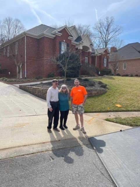 Family standing outside of home