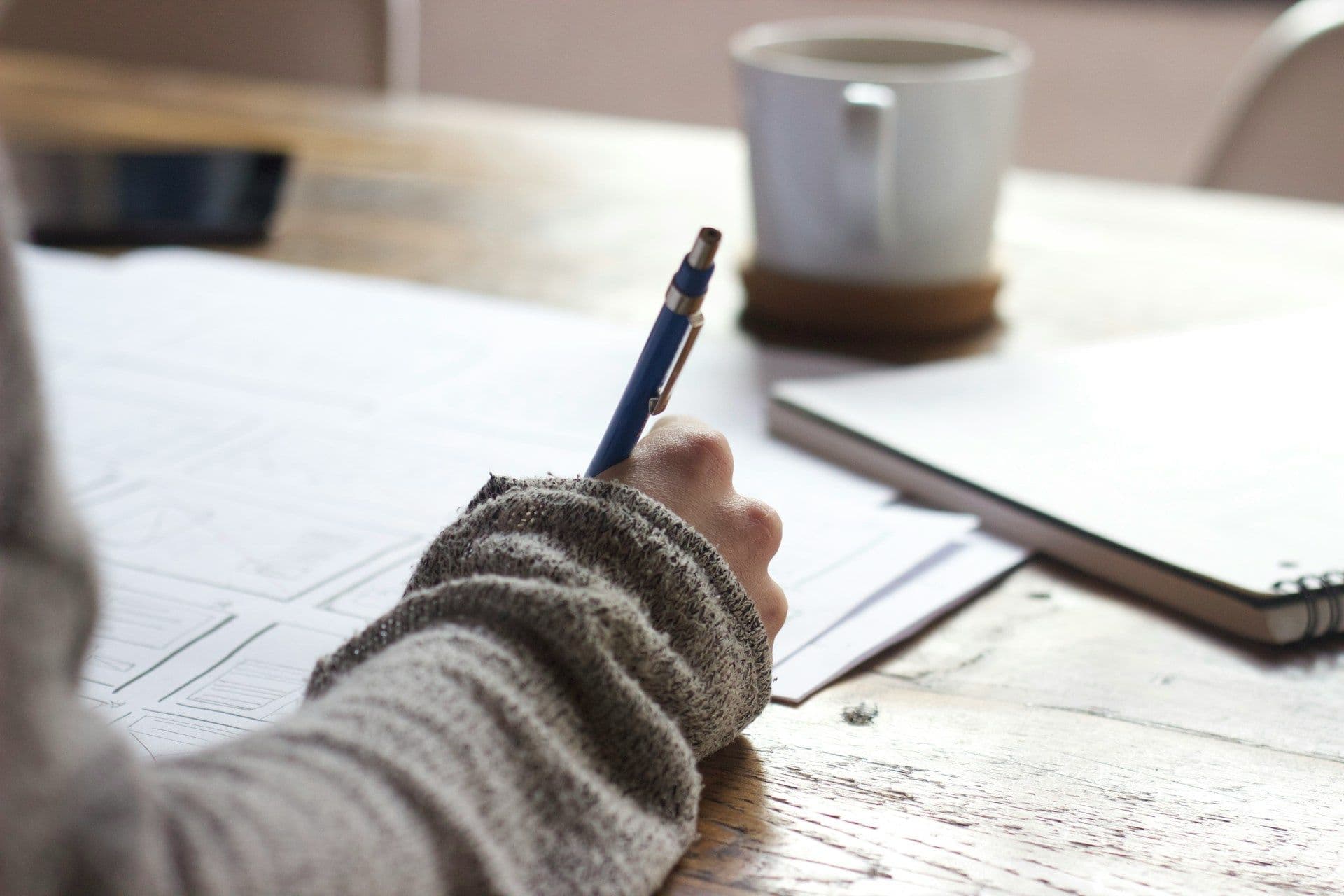 Person writing and planning something